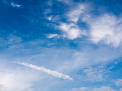 a wonderful clear sky outside with clouds streaks and lush blues so pretty and full of life and peace