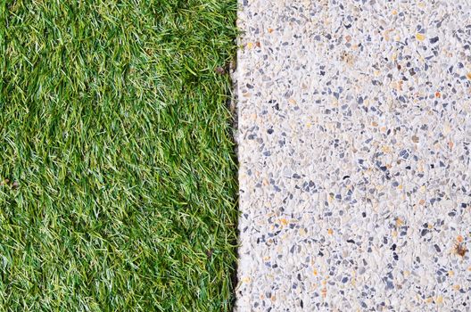 Gravel texture and strip grass as background copy space