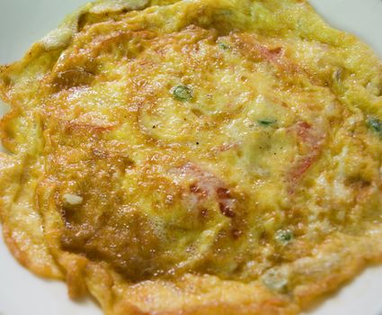 COLOR PHOTO OF FRIED OMELETE OR OMELETTE WITH VEGETABLES