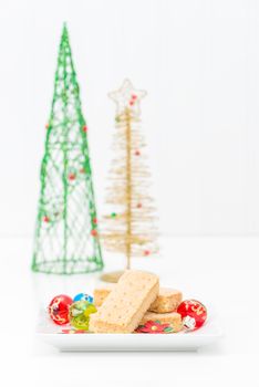 Fresh buttery shortbread cookies in a festive christmas setting.