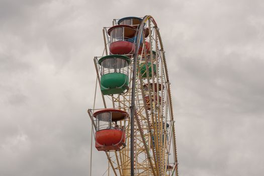 Atraktsion colorful ferris wheel against the sky.