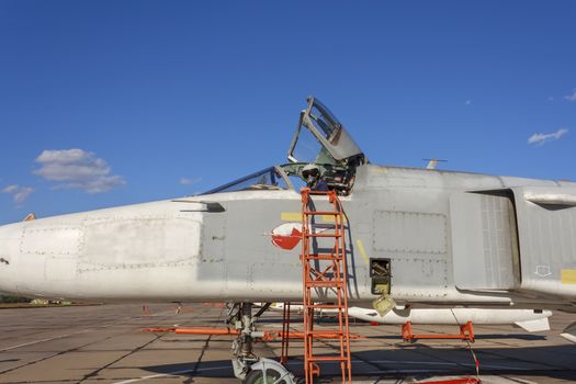 Military pilot in the cockpit of a jet aircraft.