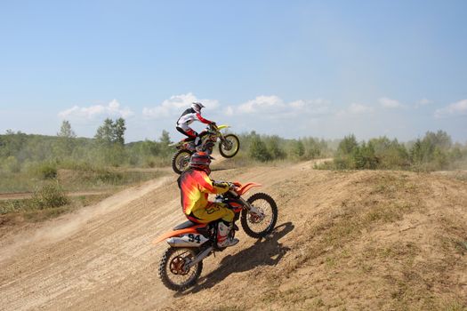 ARSENYEV, RUSSIA - AUG 30: Rider participates in the round of the 2014 Russia motocross championship on August 30, 2014 in Arsenyev, Russia.