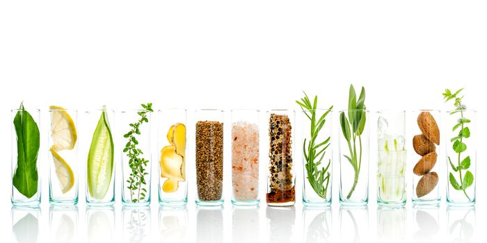 Homemade skin care and body scrubs with natural ingredients aloe vera ,lemon,cucumber ,himalayan salt ,peppermint ,lemon slice,rosemary,almonds,cucumber,ginger and honey pollen isolate on white background.