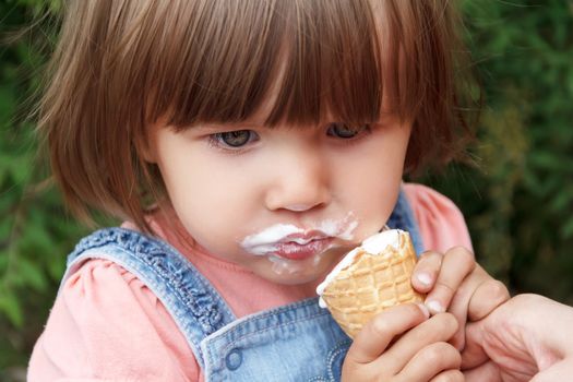 Photo of cute girl are eating icecream in summer