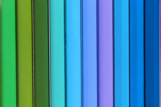 Background of parallel colorful pencils, close up