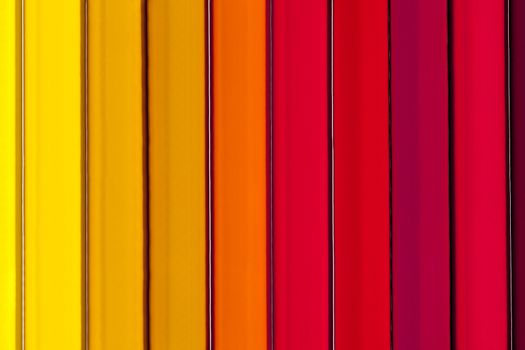Background of parallel colorful pencils, abstract,close up