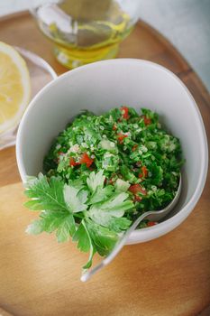 Quinoa tabbouleh salad on a wooden table.