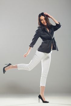 full body shot of beautiful black haired lady walking, motion shot