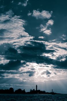 Dark blue sunset sky over the town silhouette