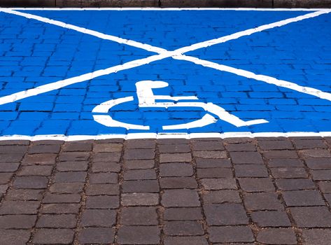 Parking space for disabled people painted on the street.