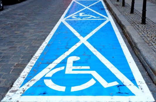 Two parking spaces for disabled people painted on the street.