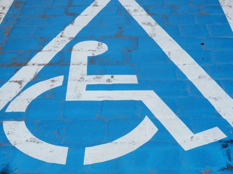 Parking space for disabled people painted on the street.