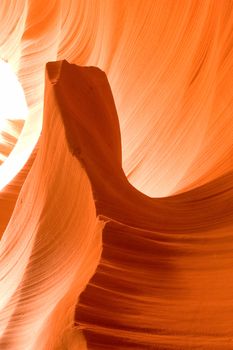 Sunlight reflected off of the red rock curves of the Antelope Canyon Slot Canyons in Page, Arizona. This shot was taken in Lower Antelope Canyon. 

Antelope Canyon is Mother Nature's work in progress. The canyon is carved from the flash flood waters of the Lake Powell basin. This canyon is a spectacular wonder and a photographers paradise.