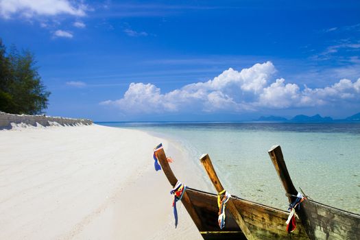 Boat on the sea, white Sand Beach at Kho Mat Sum Island Koh Samui, Thailand.