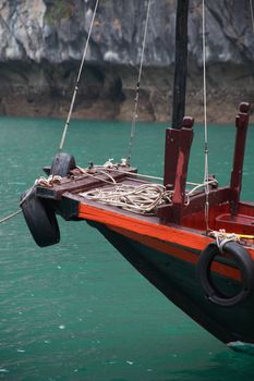 Closeup of fishing boat parking in nice lagoon with green water