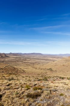 Portrait - Beautiful Graaff-Reinet view of the green valley within the mountains.