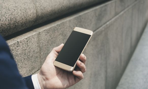 male hand holding cell phone