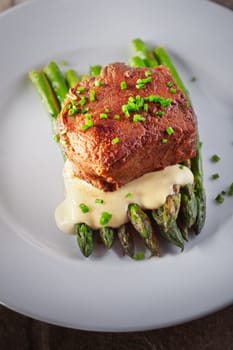 Grilled Beef with Asparagus on a white plate