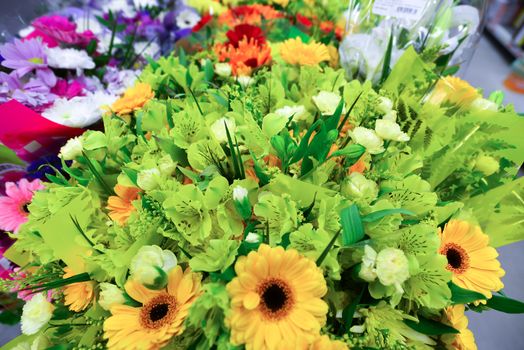 A flower bouquet with a lot of a different flowers