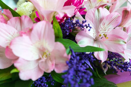 A flower bouquet with a lot of a different flowers