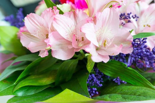 A flower bouquet with a lot of a different flowers