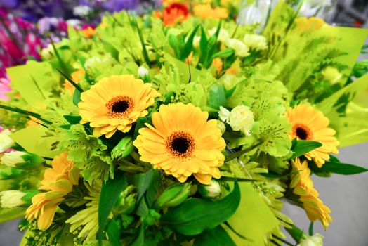 A flower bouquet with a lot of a different flowers