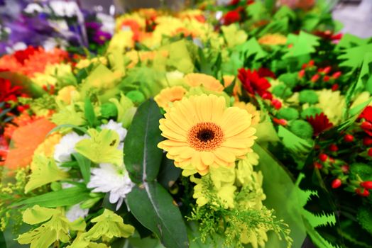 A flower bouquet with a lot of a different flowers