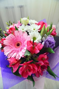 A bouquet of flowers with a gerbera