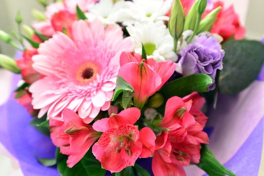 A bouquet of flowers with a gerbera