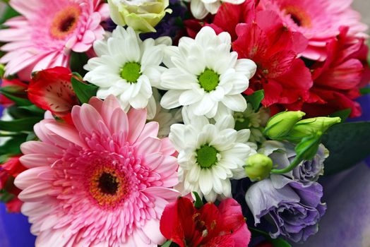 A bouquet of flowers with a gerbera