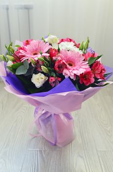 A bouquet of flowers with a gerbera