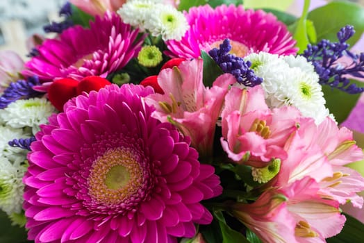 A bouquet of flowers with a gerbera