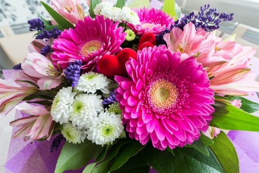 A bouquet of flowers with a gerbera