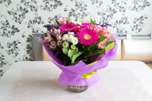 A bouquet of flowers with a gerbera