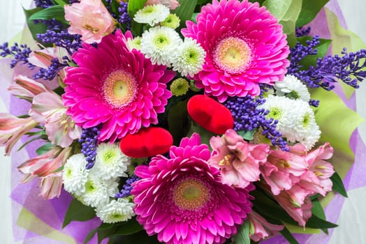 A bouquet of flowers with a gerbera