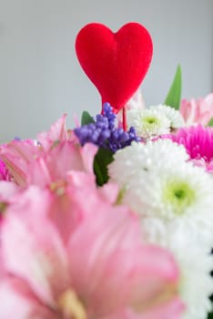 Red hearts and a bouquet of a flowers