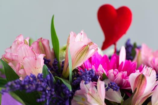 Red hearts and a bouquet of a flowers