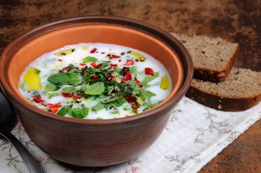 Refreshing сold summer soup the rice, mint and yoghurt, spices. Horizontal shot. 