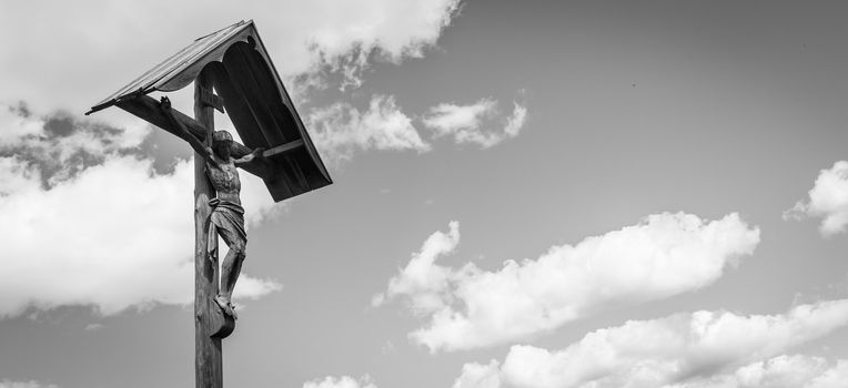 A 100 years old Crucifix, made of wood, tipical of Dolomity Region in North-East of Italy