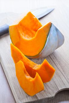 Slices of pumpkin on a wooden board