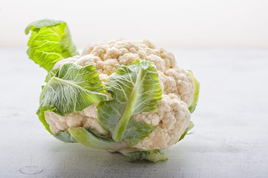 A bunch of cauliflower on the white surface