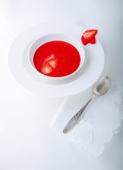 Strawberry soup with white napkin on a table