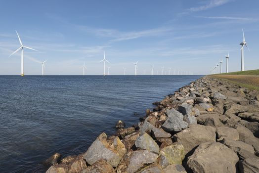 Wind park partly in the water and partly on the land in the Noordoostpolder in the Netherlands
