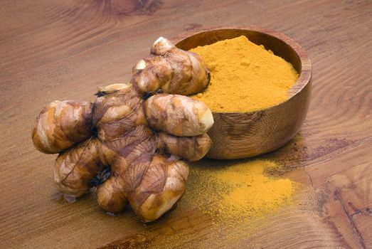 Turmeric (Curcuma longa) is a tropical plant in the same family as ginger, native to India, and cultivated throughout the tropics around the world. The spice of an intense yellow color is an essential ingredient in many recipes oriental cooking.