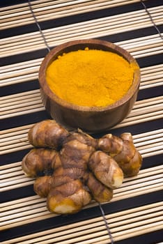 Turmeric (Curcuma longa) is a tropical plant in the same family as ginger, native to India, and cultivated throughout the tropics around the world. The spice of an intense yellow color is an essential ingredient in many recipes oriental cooking.