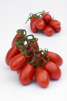 Cherry tomato (plum) of Sicily (Italy) isolated on white background