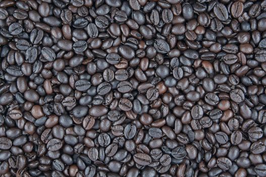 Black roasted coffee beans top view use as texture or background.