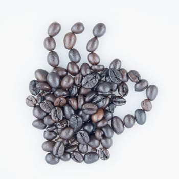 Black roasted coffee beans place as cup of coffee on white background.