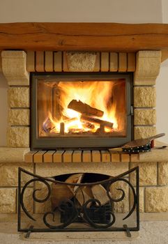 Roaring flames in modern fireplace in winter time